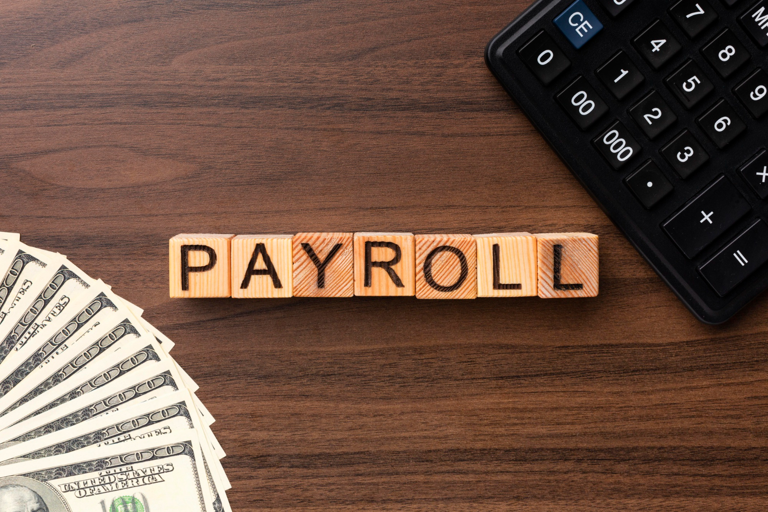 top-view-payroll-concept-with-cash-calculator